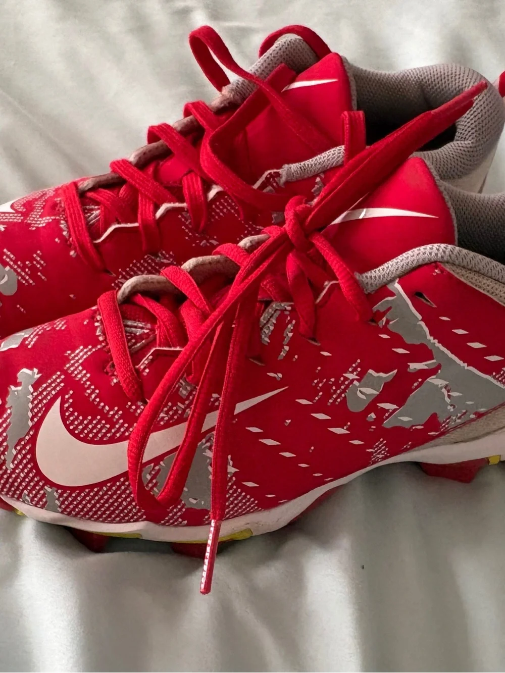 Nike Red and White Youth 4.5 Cleats with Yellow Sole Accents